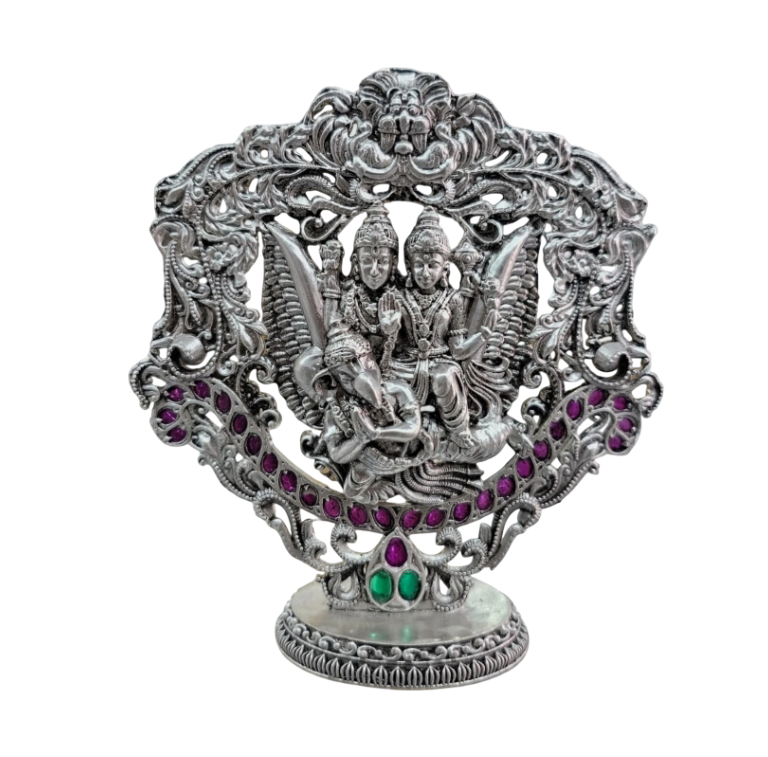 Intricate Lakshmi Vishnu Garuda statue pure silver with detailed carvings and colorful gemstone accents