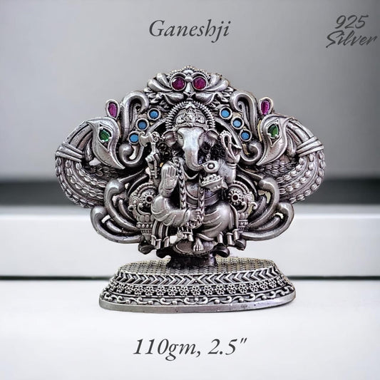 Pure silver Lord Ganesha statue weighing 110gm and measuring 2.5 inches with intricate detailing and colored gemstone accents