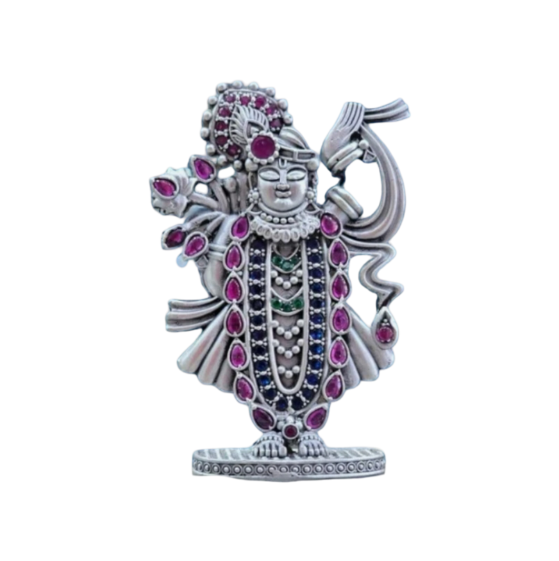 Pure silver Srinathji murti adorned with pink and green gemstones by RudraShiv Blessing