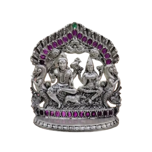 925 silver Shiv Parvati idol with intricate detailing and purple gemstone accents by RudraShiv Blessing