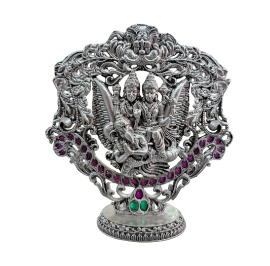 Intricate Lakshmi Vishnu Garuda statue pure silver with detailed carvings and colorful gemstone accents
