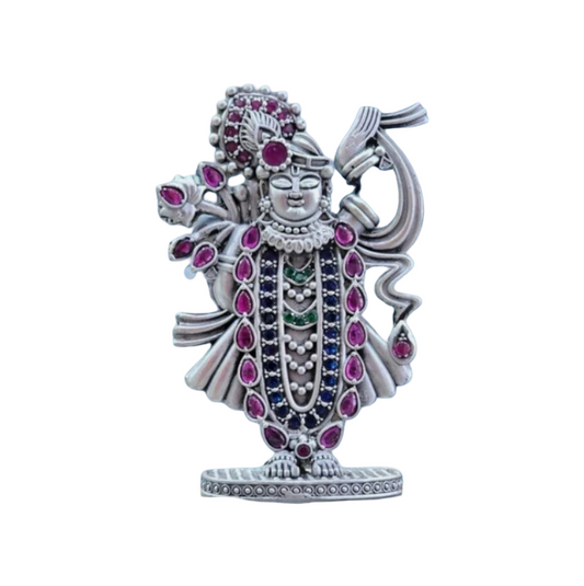 Pure silver Srinathji murti adorned with pink and green gemstones by RudraShiv Blessing